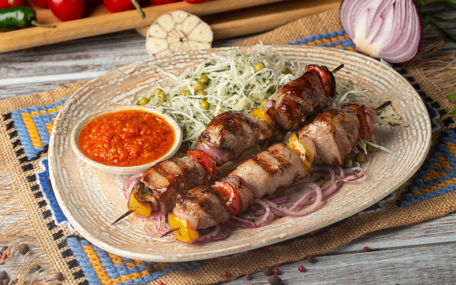 Pork kebab with salad and adjika