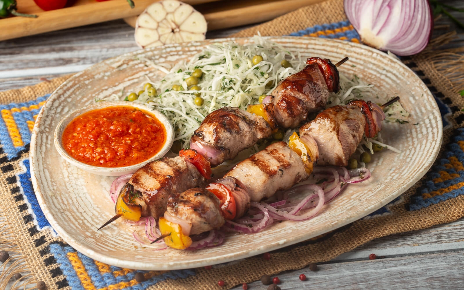 Pork shish kebab with salad and adjika