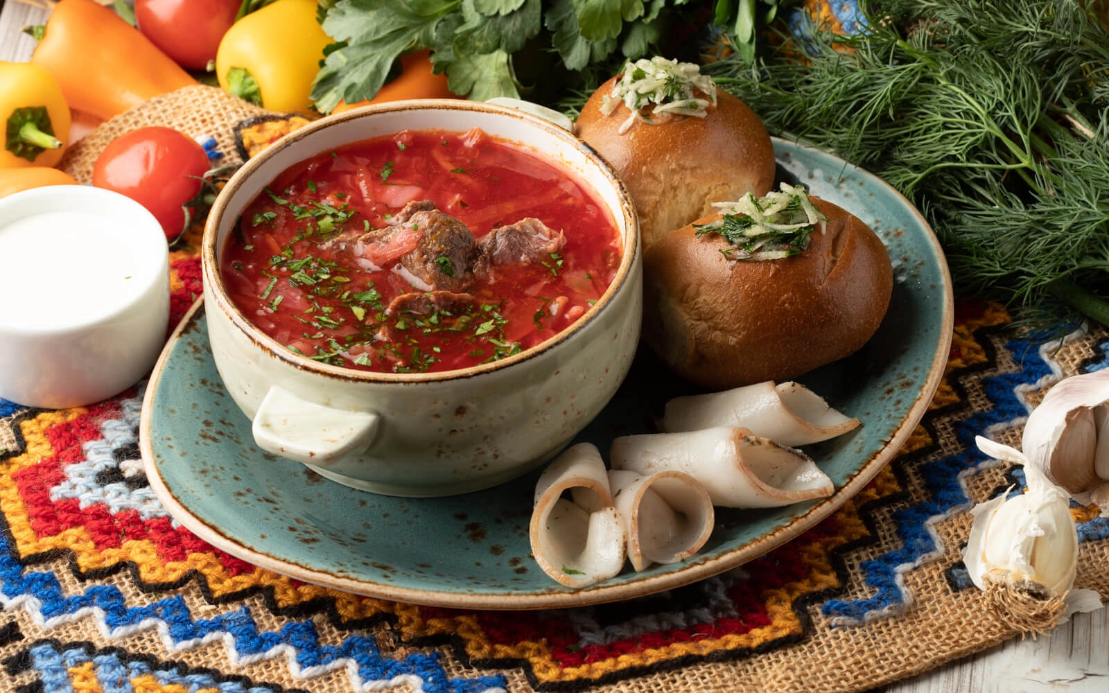 Borsch with donuts and bacon